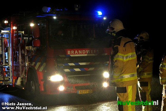 Auto in de brand na ongeval - Foto: Niels Jansen
