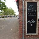 Nieuwe spreuk aan gevel Wilhelminastraat